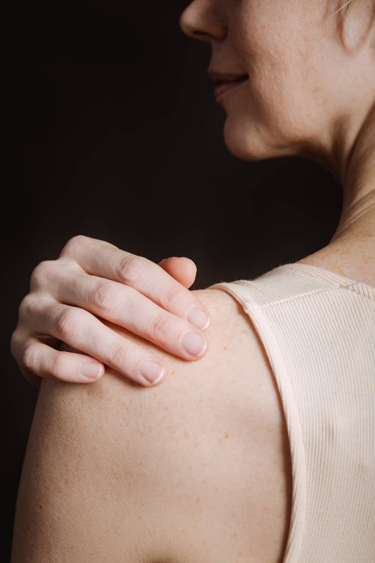 a close-up of a woman's shoulder PRP treatment